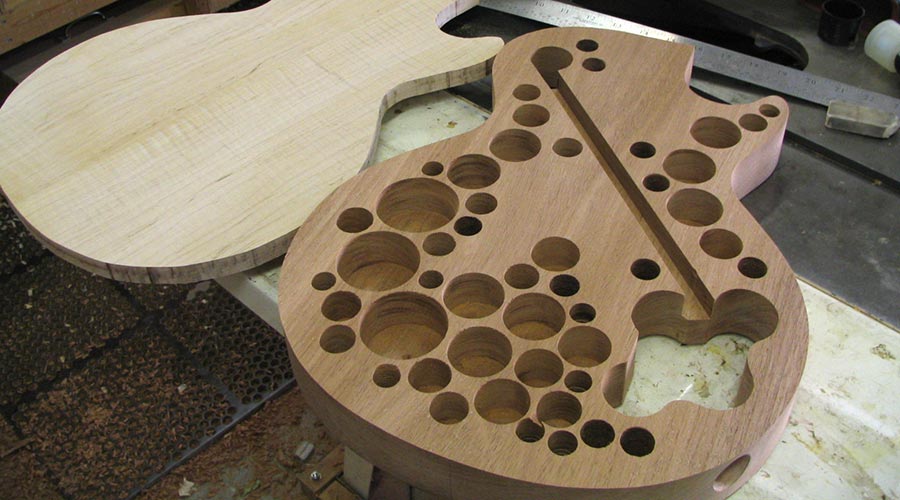 Les Paul body with weight relief holes.