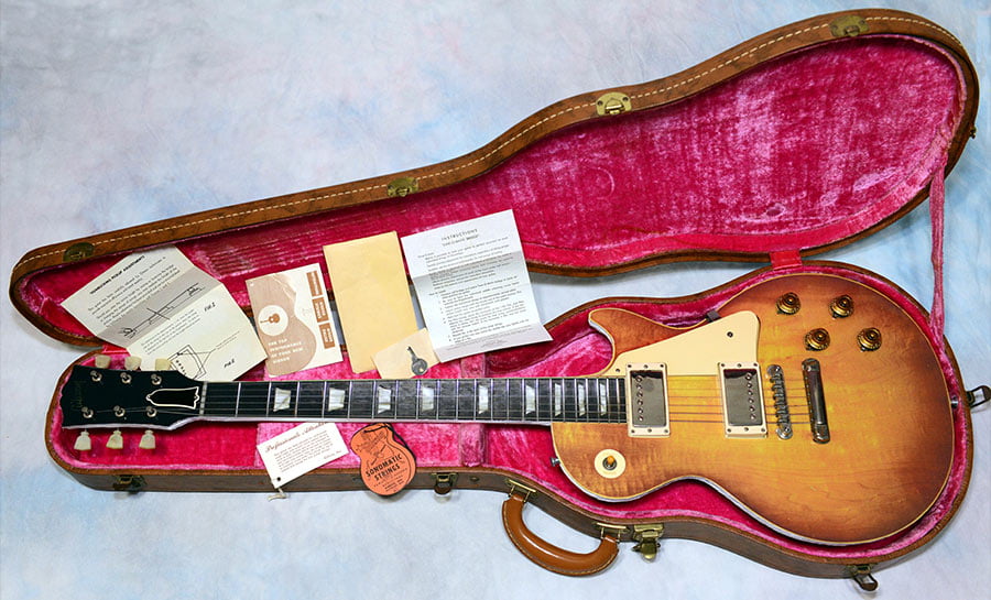 Life-size photo of a Les Paul mounted with real vintage Gibson parts.